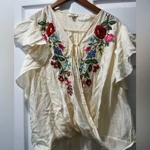 Beautiful flutter sleeve blouse. Floral design.